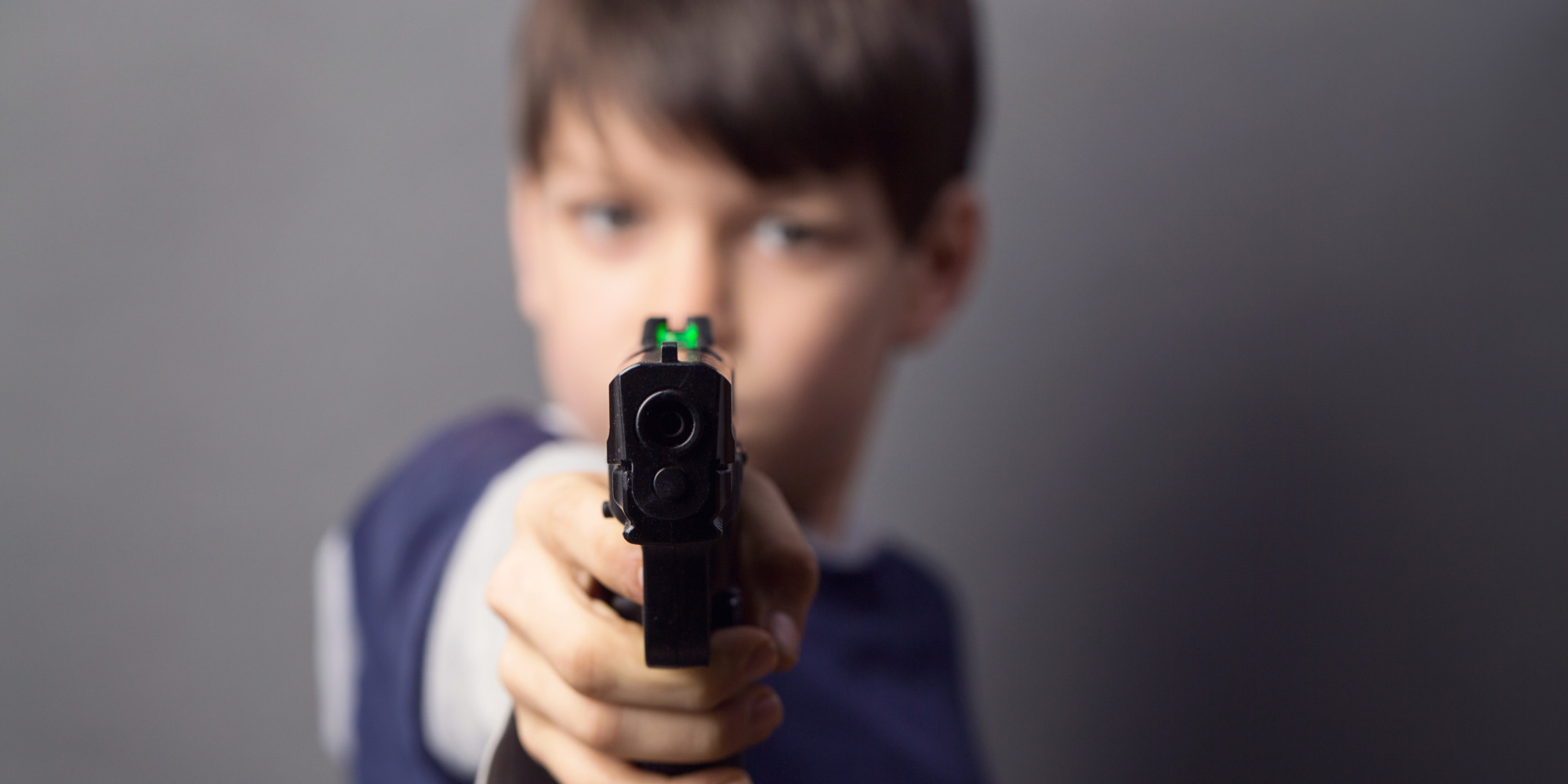 Boy with handgun